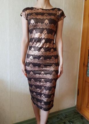 Гарне плаття з золотистим принтом з натуральної еластичної тканини.1 фото