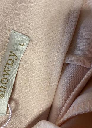 Нежно розовые брюки с воланами рюшами внизу