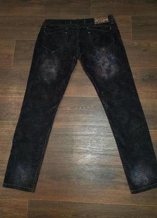 Вельветовые джинсы с цветочным принтом2 фото