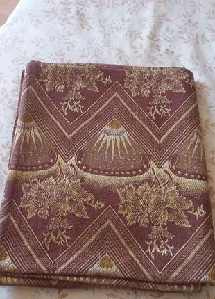 Відріз щільного коричневого з жовтим малюнком тканини розміром 1.27х1.40 м.