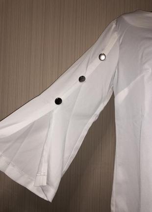 Біла блуза з розкльошеними рукавами2 фото