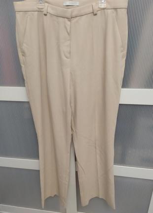 Брюки клешоние