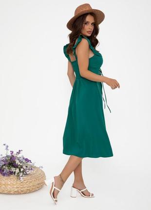 Зеленое платье декорированное передним вырезом3 фото