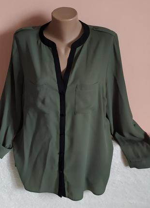 Як нова!дуже гарна шикарна нарядна блузочка з карманами та рукавами на утяжках,вказано р.16.3 фото