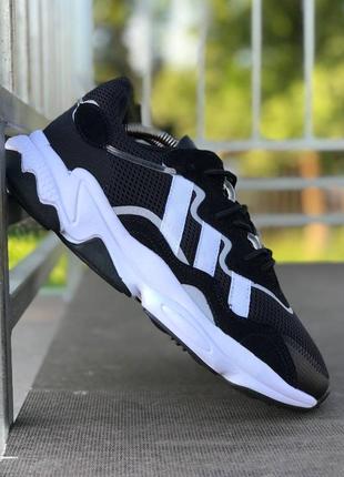 Легкие спортивные кроссовки демисезонные adidas ozweego черные в сеточку1 фото