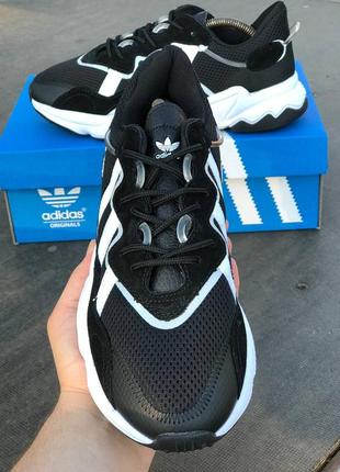 Легкие спортивные кроссовки демисезонные adidas ozweego черные в сеточку2 фото