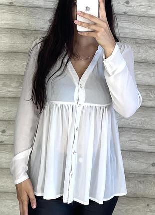 Біла напівпрозора жіноча блуза