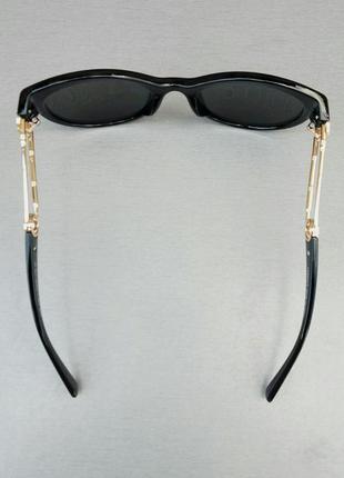 Versace стильные женские солнцезащитные очки черные с золотым логотипом5 фото