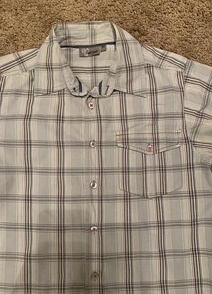 Блакитна сорочка з орнаментом на спині на 12 років