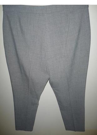 Жіночі брюки класика з рюшами на кишенях сірі р. 185 фото