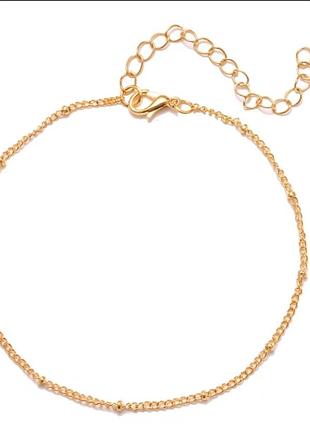 Новый стильный браслет на ножку с бусинами под золото