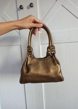 Золота сумочка бренду next