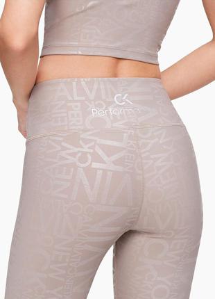 Бежеві спортивні жіночі легінси calvin klein 7/84 фото