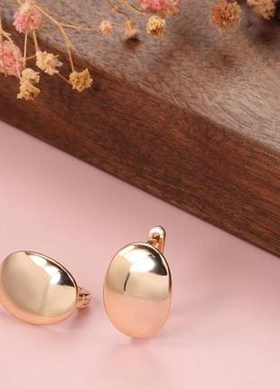 Сережки глянцеві прості геометричні колір рожевого золота овальні5 фото