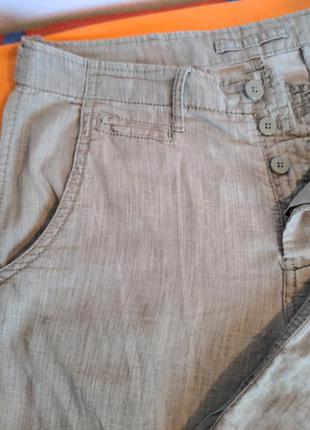 Бежевые штаны от известного бренда.7 фото