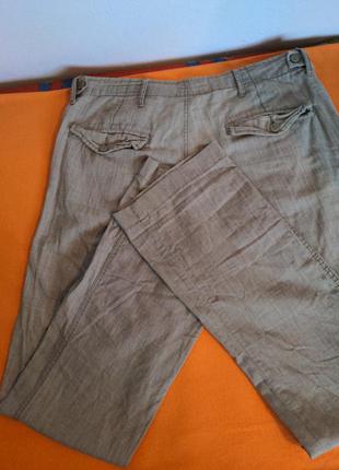 Бежевые штаны от известного бренда.8 фото