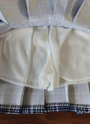 Клетчатая юбка в складку темно синяя5 фото