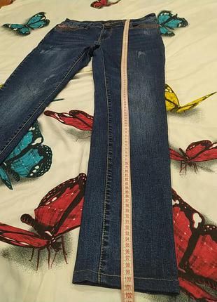 Сині джинси з потертостями6 фото