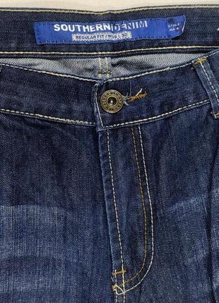 Фірмові джинси темно-синього кольору.4 фото