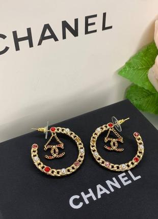 Брендовые круглые серьги  с цирконием