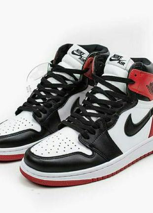 Nike jordan retro 1 кросівки чоловічі біло чорні з червоними вставками шкіра9 фото