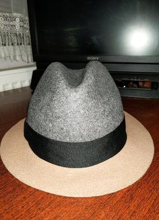 Стильная шерстяная шляпа от именитого бренда.1 фото