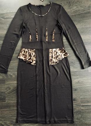 Сукню.
