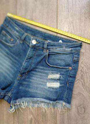 Сині, блакитні стрейч короткі джинсові шорти з тотертостями і бахромою від h&m7 фото