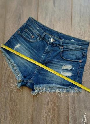 Сині, блакитні стрейч короткі джинсові шорти з тотертостями і бахромою від h&m8 фото