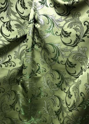 Портьерная ткань для штор жаккард зеленого цвета с вензелями