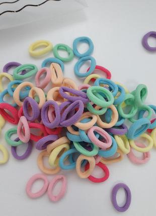 Набір кольорових гумок для волосся в сумочці3 фото