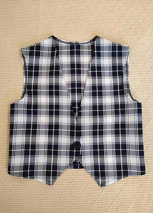 Шкільна жилетка на дівчинку 10 років