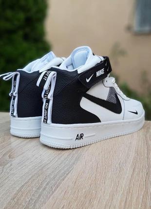 Жіночі кросівки nike air force 1 mid lv8 білі з чорним високі хутро зима7 фото