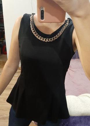 Кофта з баскою чорного кольору