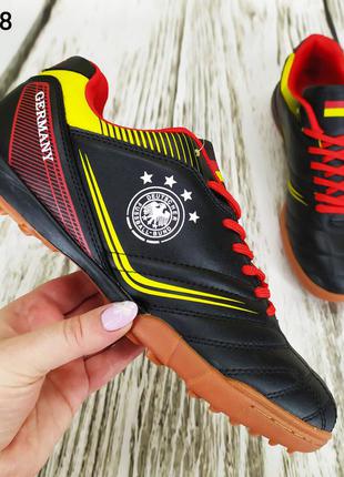 Мужские футбольные бутсы, сороконожки черные с красным и желтым veer ...