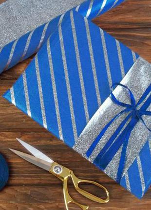 Бумага упаковочная подарочная в полоску сине-серебристая 70см*50 см (20 листов)1 фото