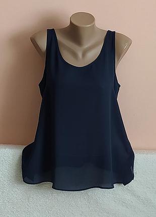 Стан нової,не носили!шикарна блузочка з розпорочками по боках,вказано р. 14.