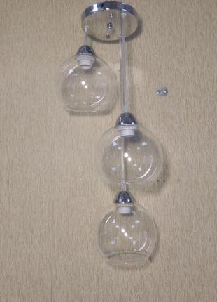 Люстра в стиле лофт с подвесными прозрачными плафонами