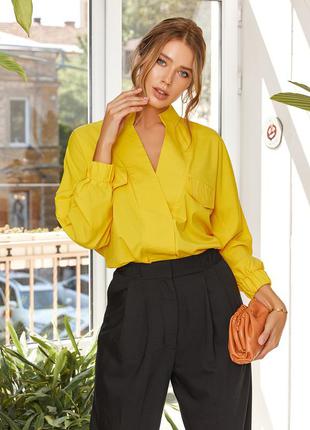 Жовта вільна блуза з клапанами