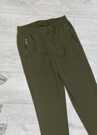 Жіночі брюки оливкового кольору розмір м2 фото