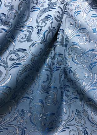 Портьерная ткань для штор жаккард голубого цвета с вензелями