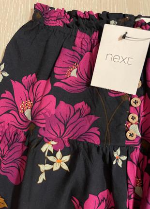 Очень красивая и стильная брендовая юбка в цветах.9 фото