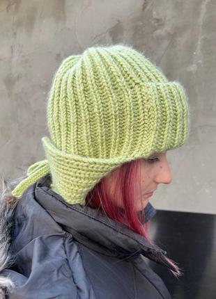 Тренд сезона шапка-ушанка крупной вязкой ангора