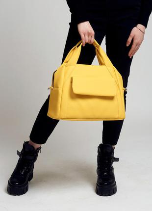 Жіноча стильна і містка спортивна жовта сумка8 фото