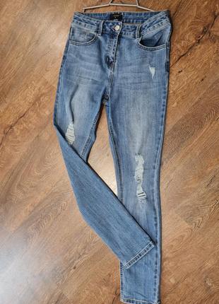 Очень крутые джинсы с дырками на высокой посадке denim1 фото