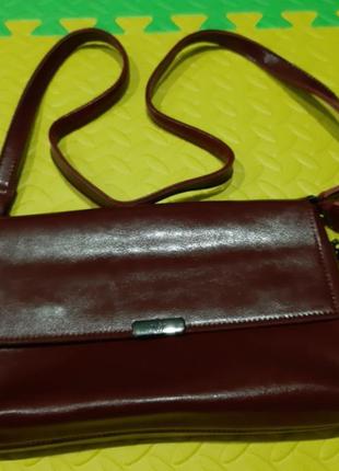 Кожаная сумка на длинном ремешке