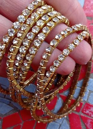 Браслет з каменями на резинці, браслет зі стразами золотий