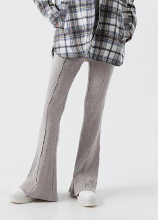 Брюки женские леггинсы cropp трикотажные клешни расклешенные