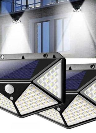 Комплект світлодіодних настінних світильників на сонячній батареї solar motion 100 led з датчиком руху 2 шт. чорний.1 фото