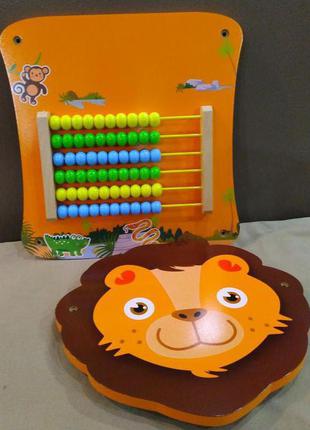 Настінна дерев'яна розвиваюча іграшка лев з рахунками playtive2 фото